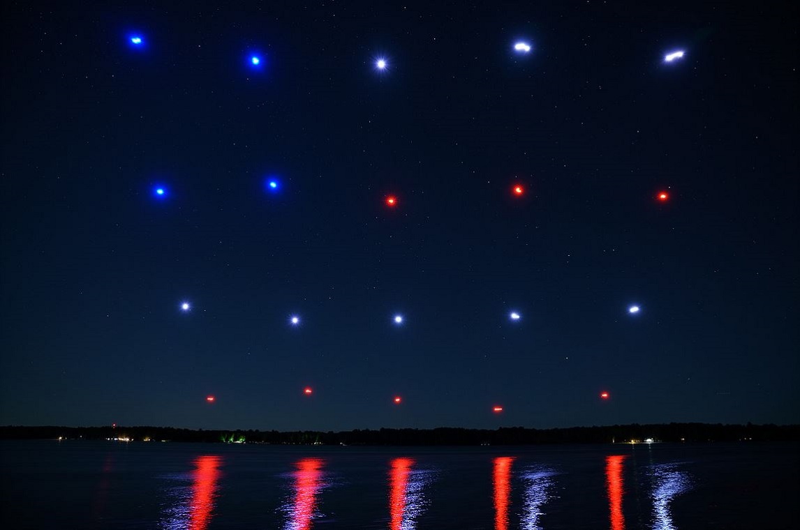 firefly drones create a flag pattern in night sky