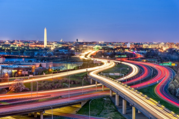 long exposure image of DC showing traffic and Washington Monument in the background