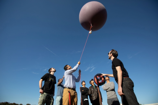 Capitol tech students holding a high altitude balloon for launch