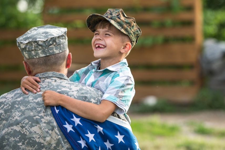 A soldier holds his smiling child