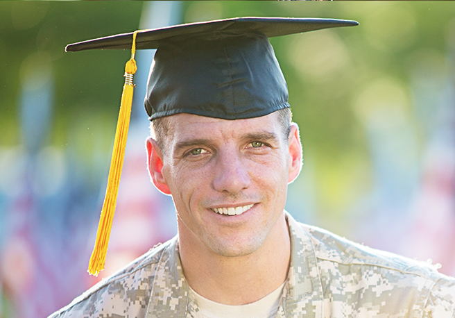 Stock image of a soldier wearing a graduation cap