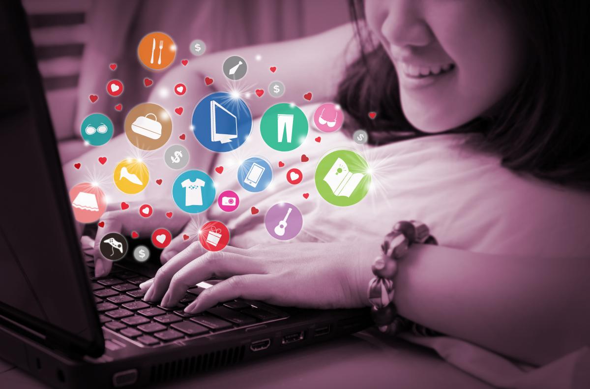 Graphic featuring a woman shopping with her laptop as various icons swirl in her presence.