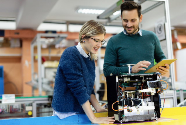two mechatronics engineers smiling 