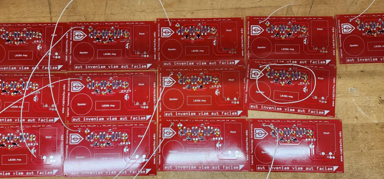 Set of red DEF CON 31 badges in production