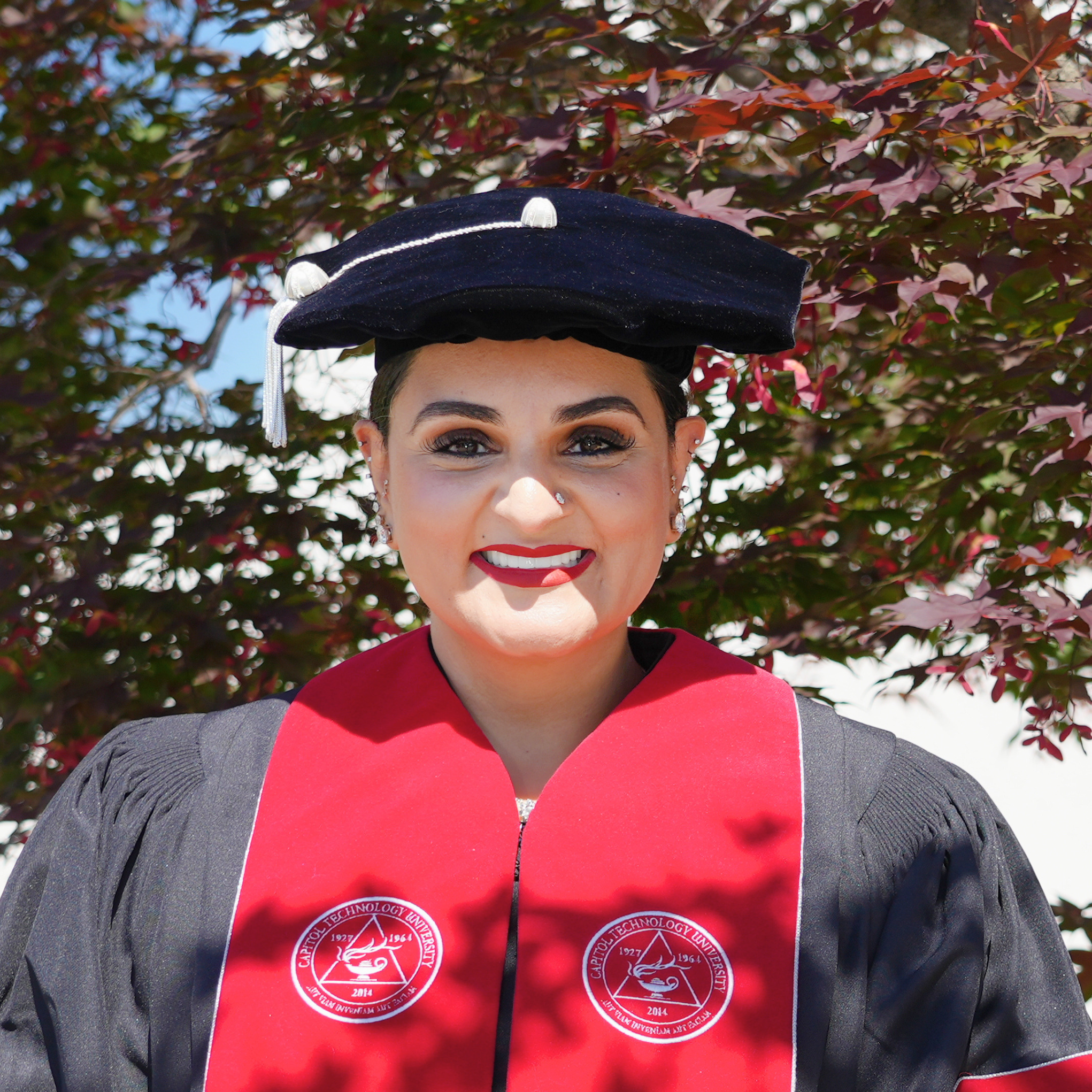 Dr. Tamanpreet Kaur appears in her doctoral regalia