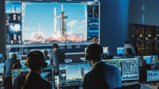 Mission Control Astronautical Engineers Viewing Space Launch