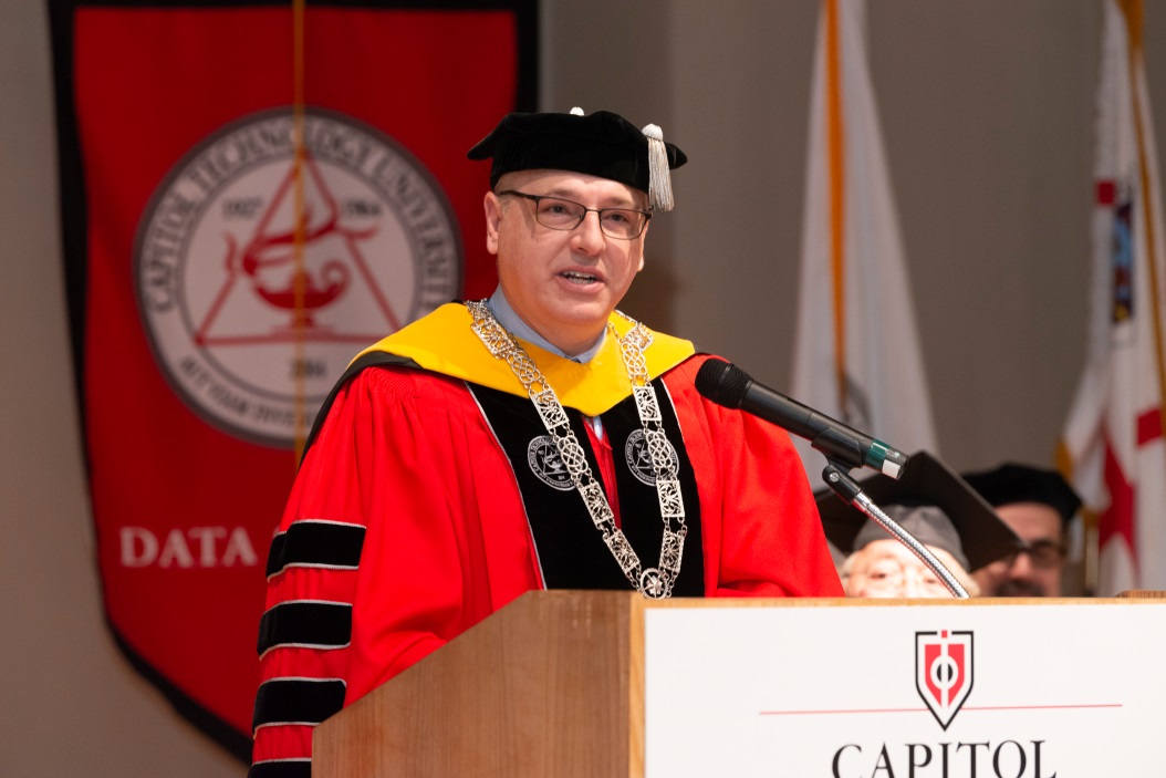 President Brad Sims presenting at commencement