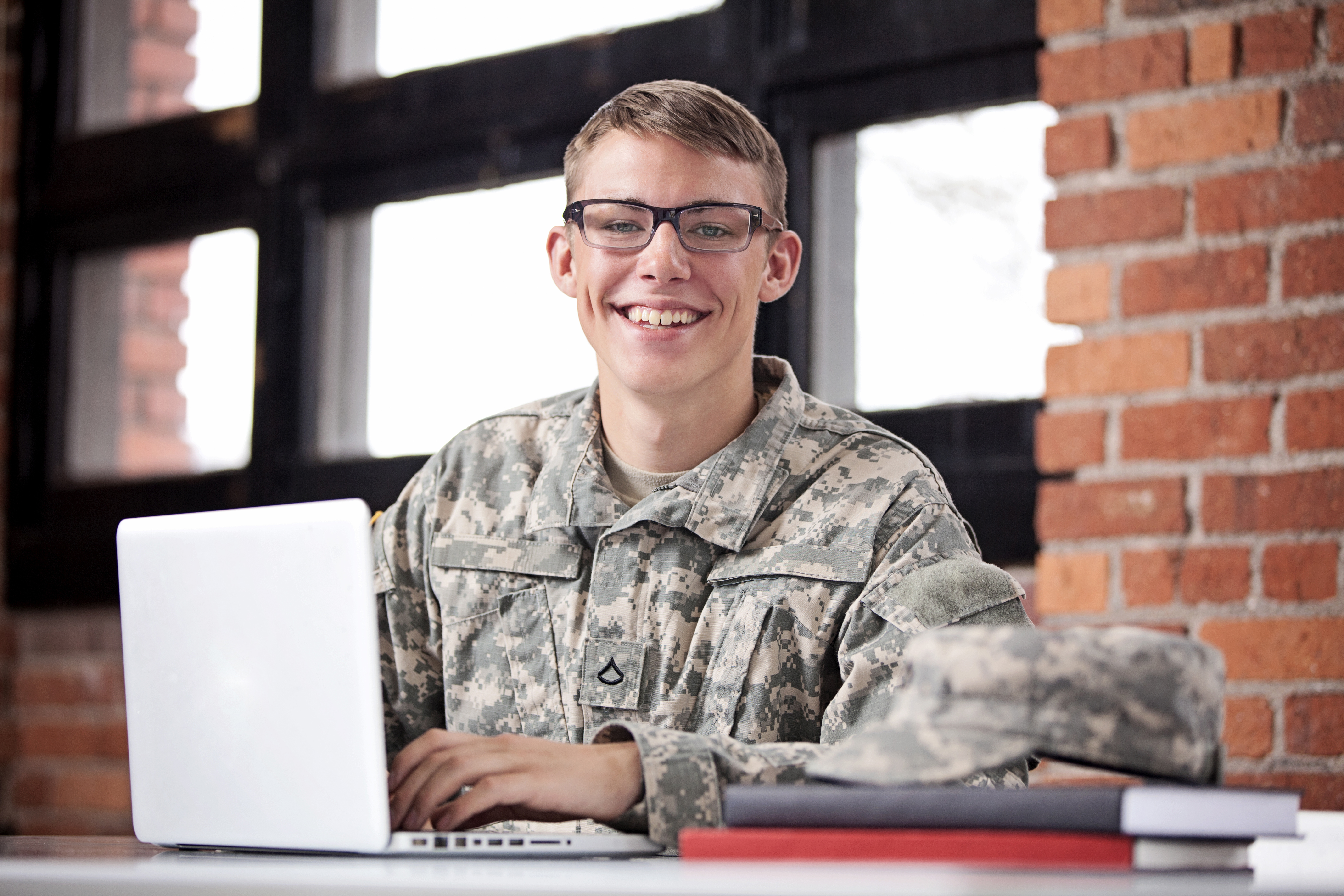 Photo of a soldier studying online