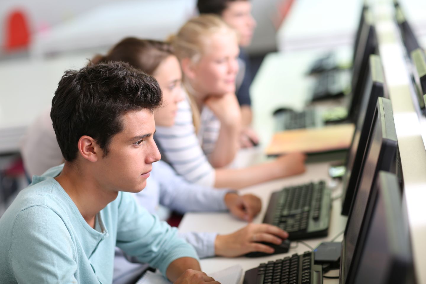 Students using computers. goodluz. AdobeStock