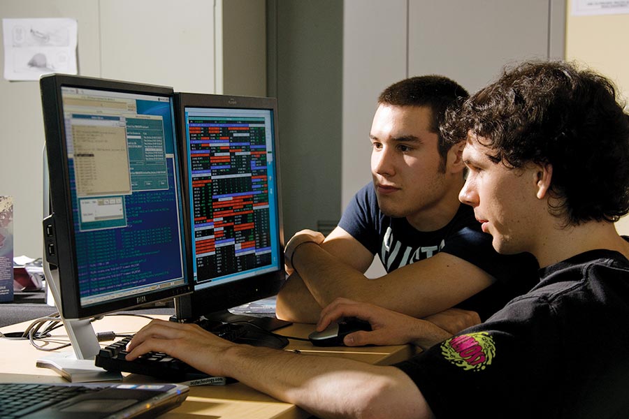 Two students working at computer