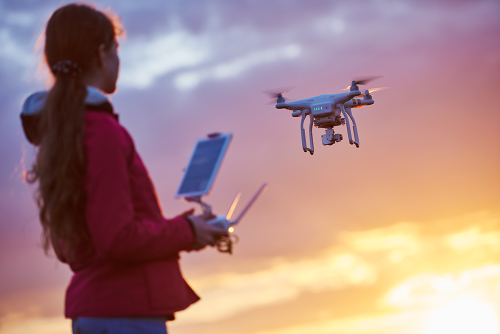 Woman flying a huge drone