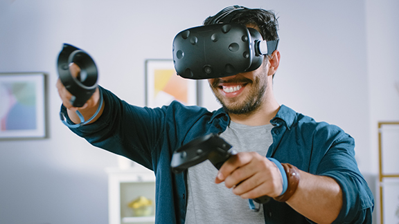 person playing virtual reality game with headset