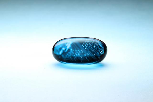 blue pill with sensors symbolizing medical mechatronics