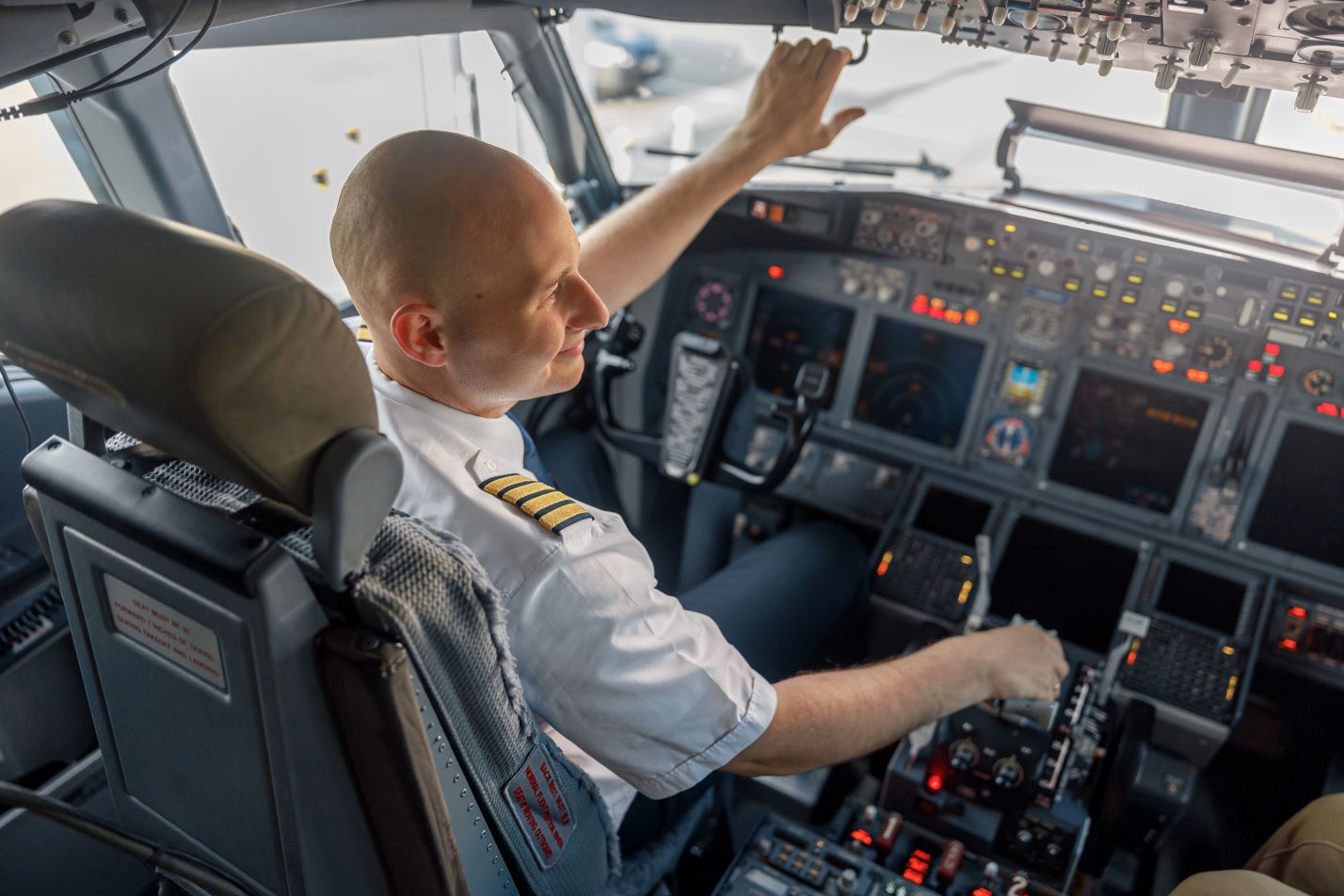 pilot in airplane cockpit