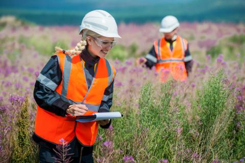 scientists in flower field 