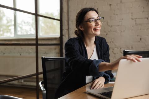 smiling woman with laptop