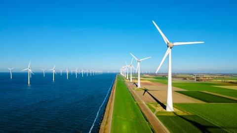 wind turbines next to water