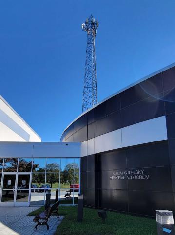 Capitol Technology University, Laurel, MD Campus, Gudelsky Memorial Auditorium with background Radio Tower, 2021