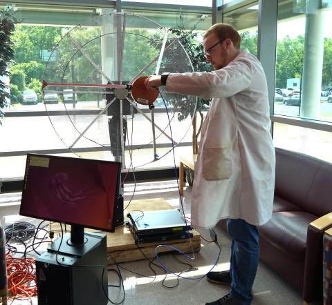 Elijah Emory with Satellite Ground Station Testing Antenna