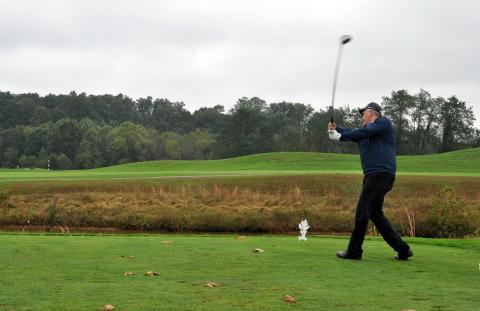 Photo of a golfer at the 11th annual Capitol Tech golf tournament