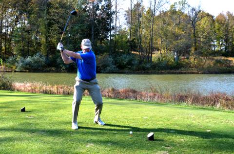 A tournament golfer at Capitol's annual scholarship golf tournament