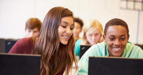 Stock photo depicting kids using a computer