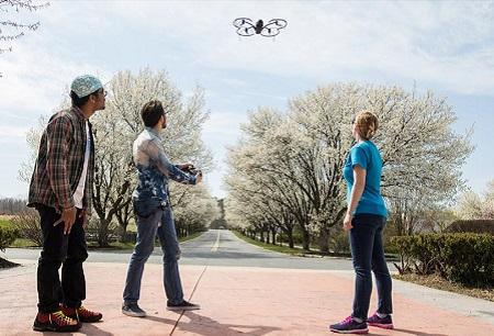 students flying a drone