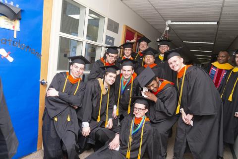 Undergrad students at commencement, fun pose