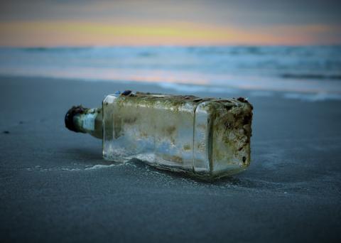 dirty bottle washed ashore