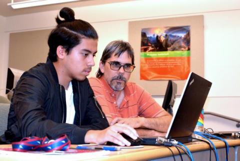 Dr. Sandy Antunes assists a young coder at a Capitol summer camp