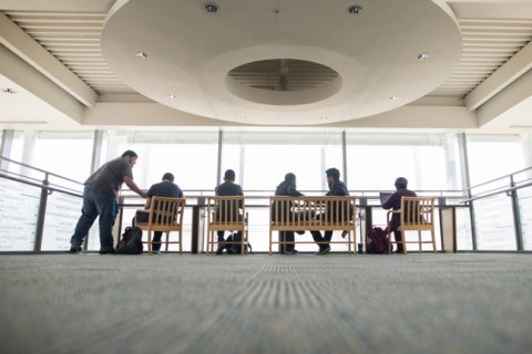 professionals sitting in office building lobby