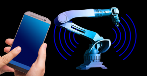 hand holding mobile phone showing internet of things and how it connects to mechatronics