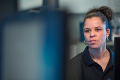 Cybersecurity professor, Mary Margaret Chantre looking at computer screen