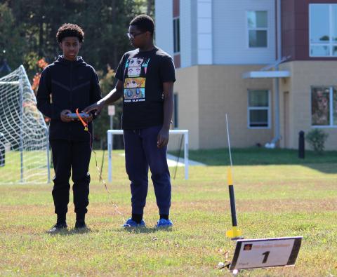 students about to launch rocket