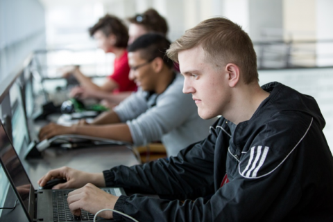 cybersecurity students working in computer lab