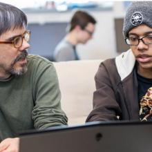 Dr. Antunes and a student work on technology projects that prepare students for STEM careers in the Fusion Lab