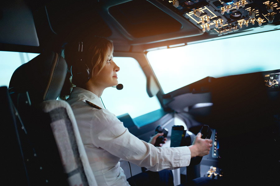 A female pilot in a flight simulator